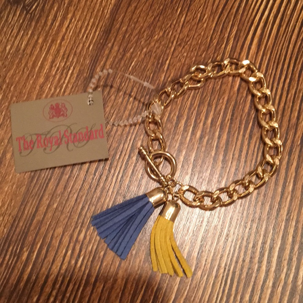 Gold bracelet with yellow/blue tassels